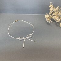 گردنبند مهره‌ای ظریف با پاپیون