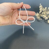 گردنبند مهره‌ای ظریف با پاپیون